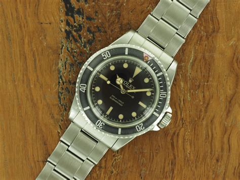 rolex submariner red triangle